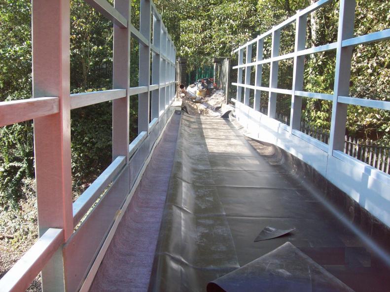 Waterproofing being laid on the bridge deck.