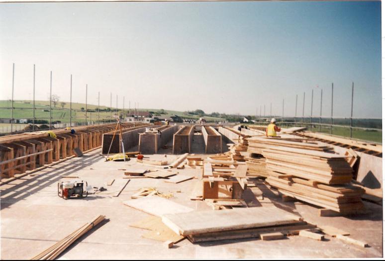 Central timber coffins being set up on the deck along with the edge formwork.