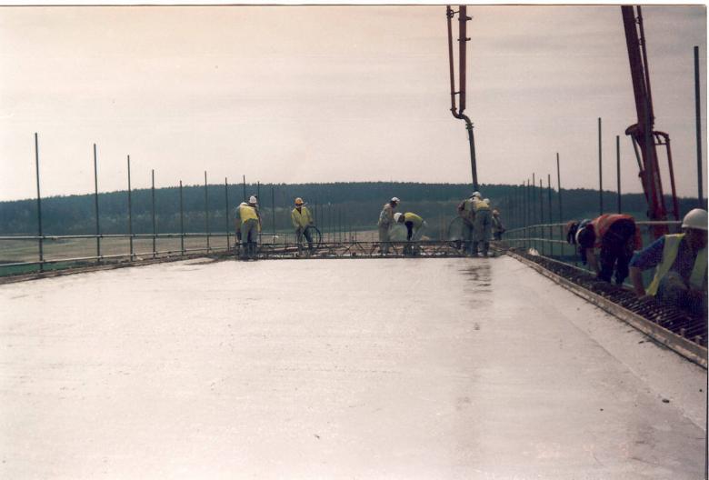 Bridge deck being cast - screed being used to level the deck.