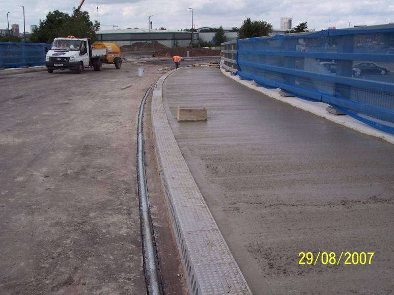 Concrete being placed in the bridge verge